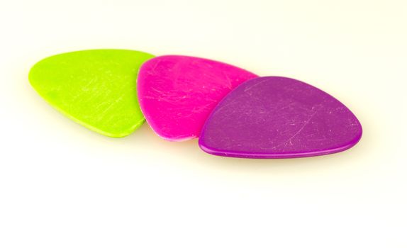 Three Plectrum Close Up on white background.