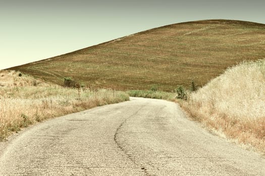 Winding Asphalt Road between Fields of Sicily, Retro Image Filtered Style