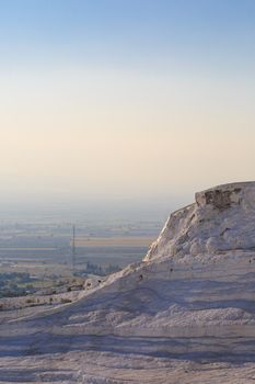 View of white hill in Pamukkale on clear sky background, Denizli, Turkey.