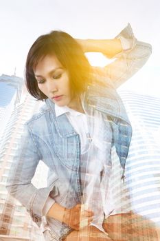 Double exposure of Asian lady and building skyscraper - lifestyle in city concept
