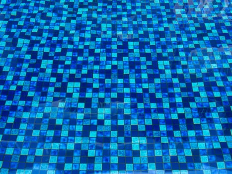 pattern of blue tiles in swimming pool