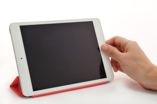 Hand holding a tablet