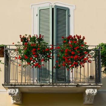 Renovated Facade of the Old Italian House with Balcony Decorated with Fresh Flowers, Instagram Effect 