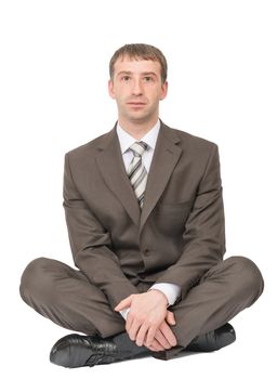 Businessman in lotus posture looking at camera on isolated white background