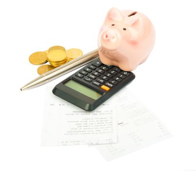 Piggy bank with pen and bills on isolated white background
