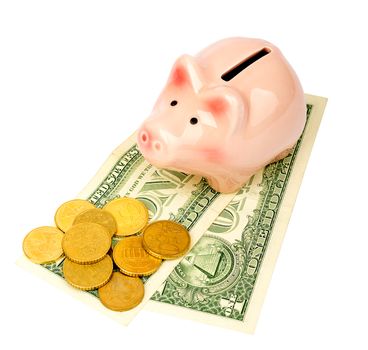 Piggy bank with coins and dollars on isolated white background