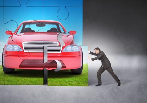 Businessman making puzzle with picture of car