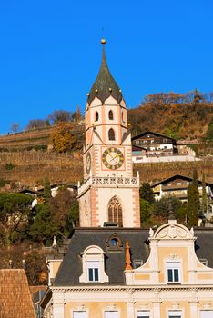 Detail of the bell tower of the Cathedral of St. Nicholas (1302-1465) in Merano, Bolzano, Trentino Alto Adige, Italy