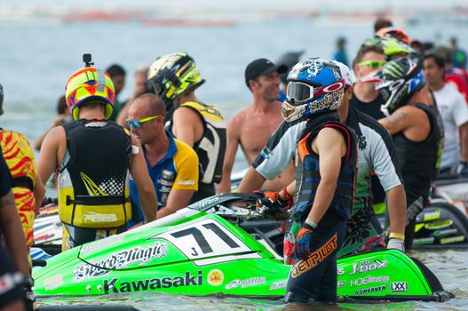 Pattaya, Thailand - December 6, 2015: Riders at the starting line with Shotaro Kokubun from Japan in the foreground at International Jet Ski World Cup at Jomtien Beach, Pattaya, Thailand.