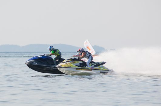Pattaya, Thailand - December 6, 2015: Hajime Isahai from Japan and James Bushell from the UK competing in the Pro Runabout Class of the International Jet Ski World Cup at Jomtien Beach, Pattaya, Thailand.