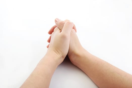 hands together resting on top of a  white plain background