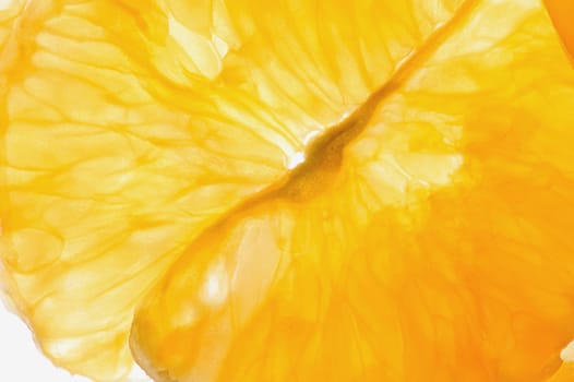 Macro of mandarines slices on white background