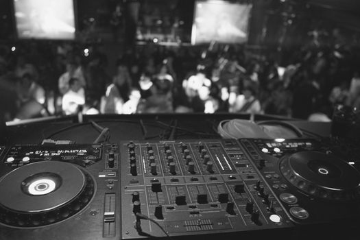 Black white dj mixer in nightclub