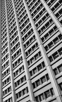 A high angle view upward of the window ports and columns of an office building in Ottawa, Ontario.