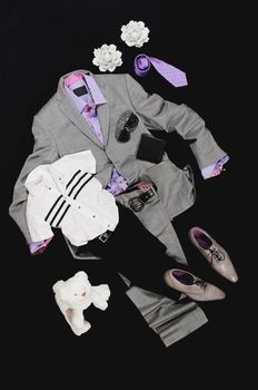 Composition of grey costume and  shoes with violet shirt and tie