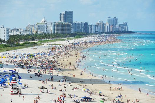 People on miami beach on sunny day