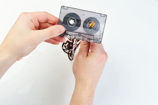 rewind Audio casette with tape on a white background