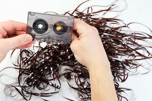 rewind audio casette with tape on a white background