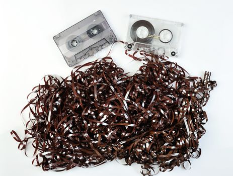 tape casettes on white background with curved tape