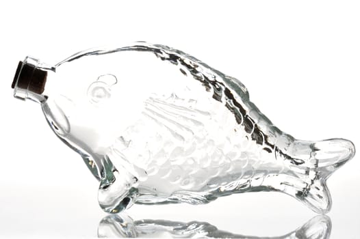 Empty fish shape bottle on a white background