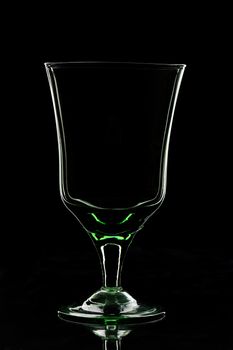 silhouette of empty glass staying on a black background