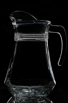 silhouette of empty jug on a black background