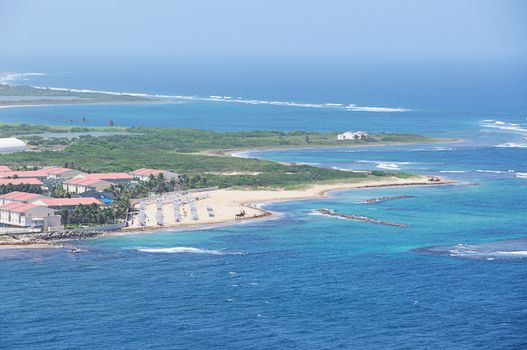 Caribbean beach in sunny day from aerial view