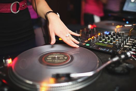 Close up of hand girl playing in vinyl