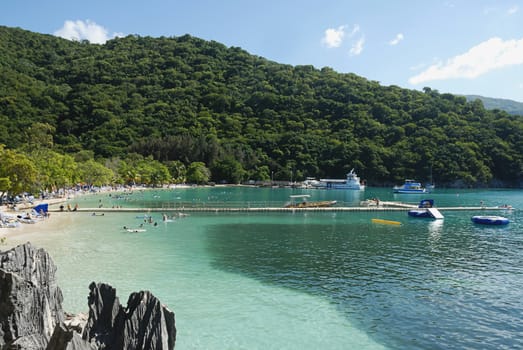 People enjoying day on beach in Haiti