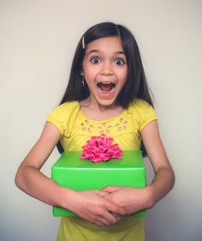 Young girl with borwn hair acts in studio.