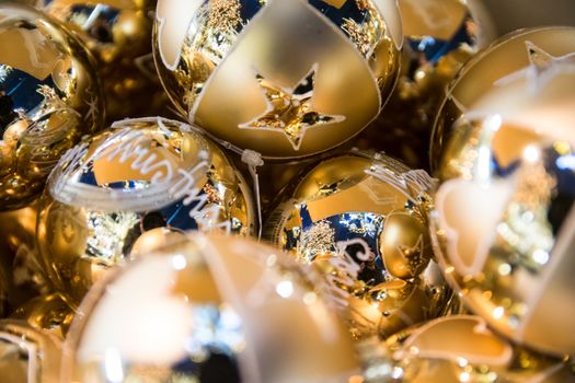 Background formed by golden balls for christmas tree.