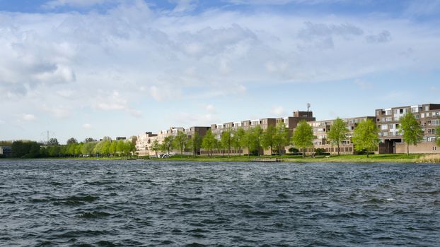 Apartment buildings around Weer water in Almere Stad, Netherlands 