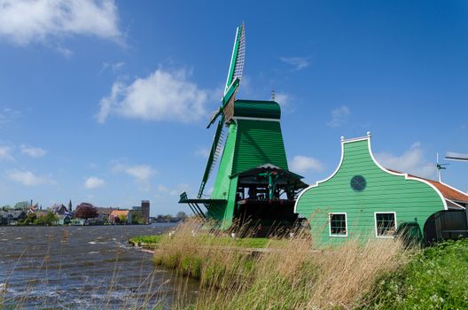 Green wind mill of Zaanse Schans in The Netherlands