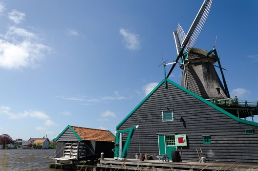 Wind mill with rural house of Zaanse Schans in The Netherlands