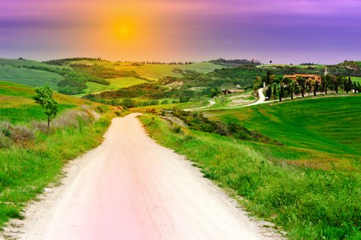 Dirt Road Leading to the Farmhouse in Tuscany at Sunset