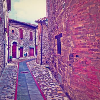 Narrow Street with Old Buildings in Italian City of Doglio, Instagram Effect