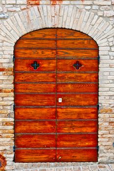 Door in a Brick Wall of the Old  Italian House