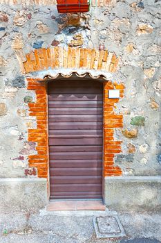 Door in a Brick Wall of the Old  Italian House