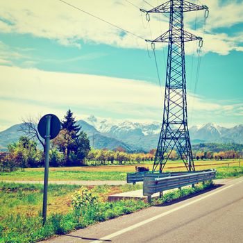 High-voltage Power Line in Piedmont on the Background of Snow-capped Alps, Instagram Effect