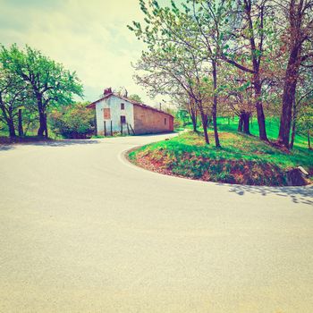 Abrupt Bend in the Asphalt Road in the Italian Alps, Instagram Effect