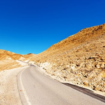 Winding Asphalt Road in the Negev Desert in Israel