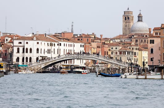 VENICE, ITALY- NOVEMBER 29: People crossing Grand canal on the bridge near by Train station Venezia Santa Lucia in Venice, Italy on November 29, 2015.