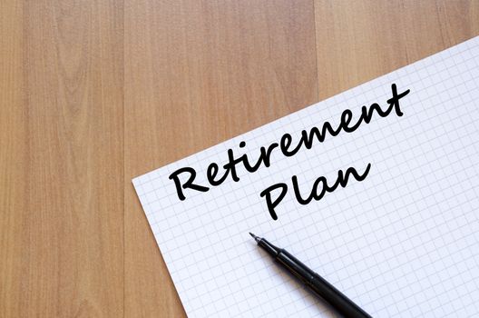 Retirement plan text concept write on notebook with pen