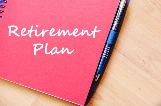 Retirement plan text concept write on notebook with pen
