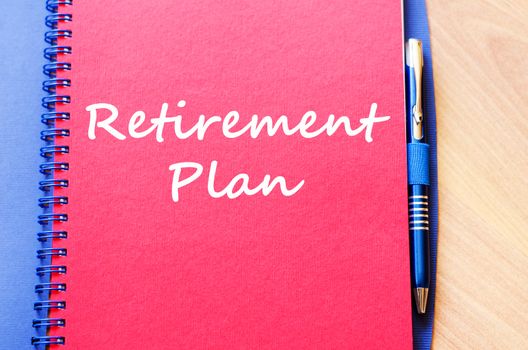 Retirement plan text concept write on notebook with pen