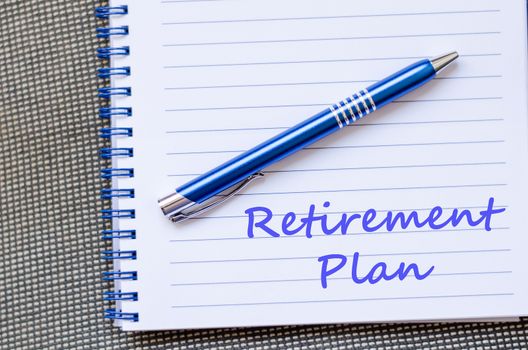 Retirement plan text concept write on notebook with pen