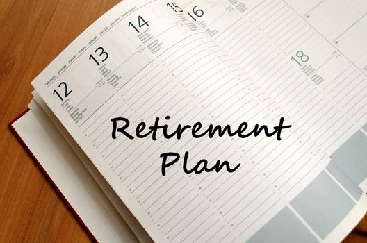 Retirement plan text concept write on notebook with pen