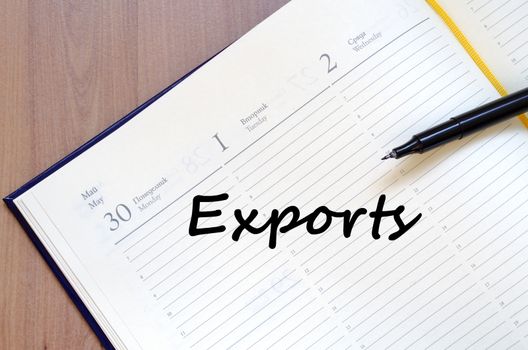 Exports text concept write on notebook with pen