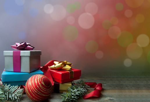 Christmas gifts and decorations with bokeh background space 