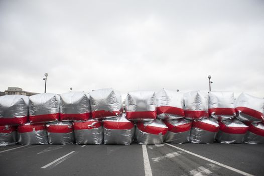FRANCE, Paris : Dozens of giant red and silver balloons are seen in Paris on December 12, 2015 as part of a big climate march organized by several NGOs. Thousands of people demonstrated to demand climate justice and environment protection. 